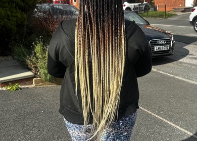 Long, stylish braids showcased at Luxury hair by honeybee, Crewe, England, GB on a sunny day.