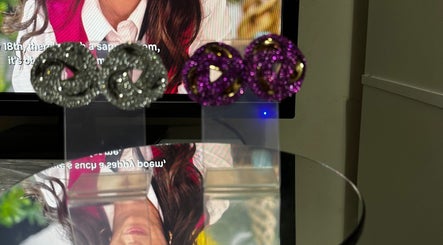 Shimmering earrings displayed at Luxury hair by honeybee, Crewe, England, GB.