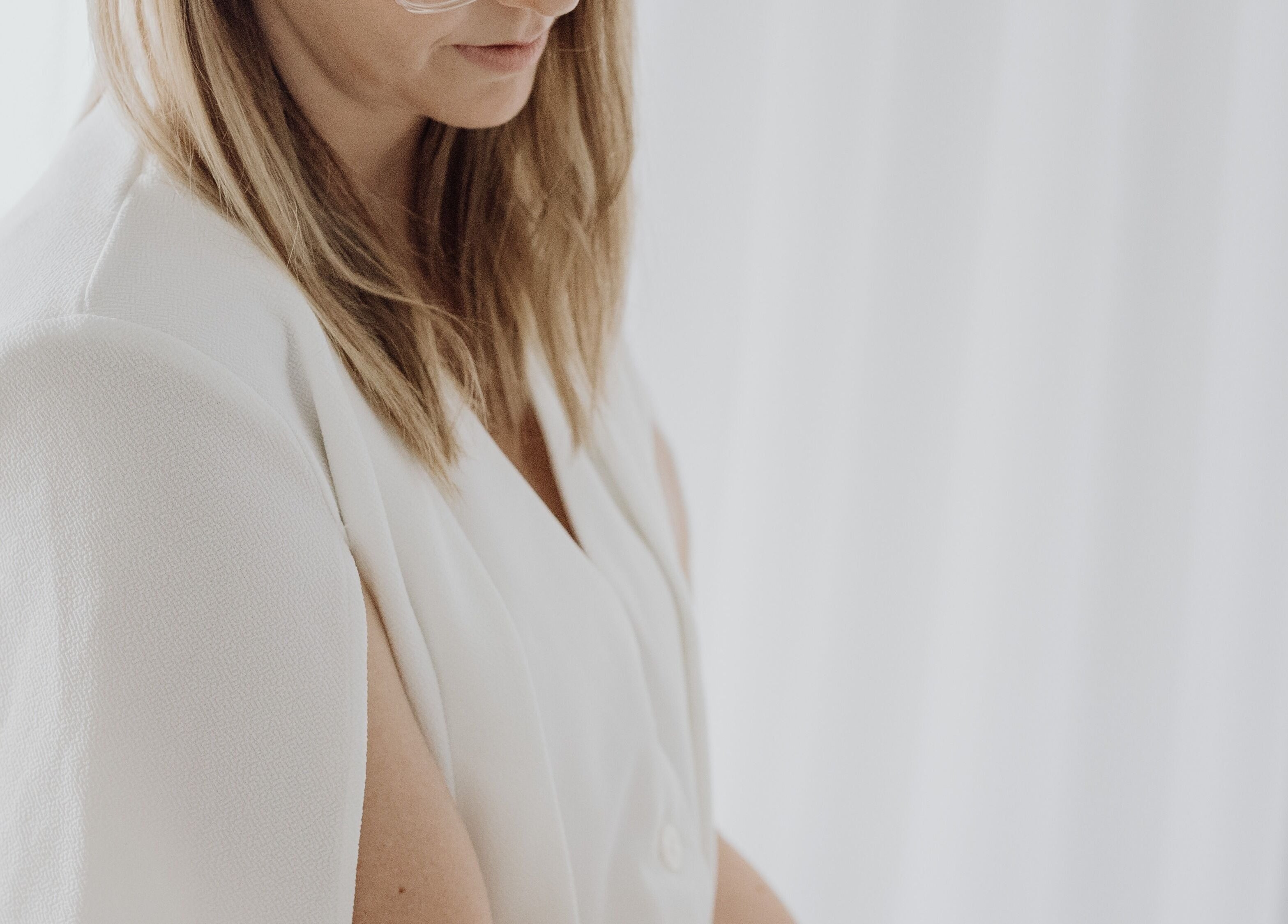 Professional woman at Beauty on Bertha in Logan Reserve, Queensland, AU, exudes elegance in a serene setting.