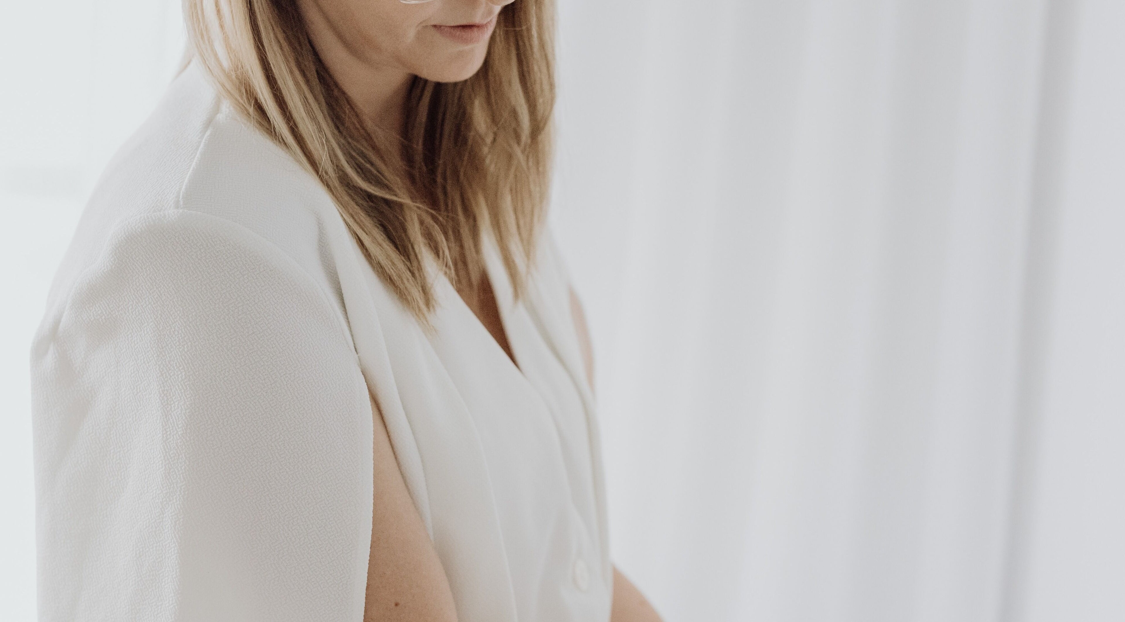 Professional woman at Beauty on Bertha in Logan Reserve, Queensland, AU, exudes elegance in a serene setting.