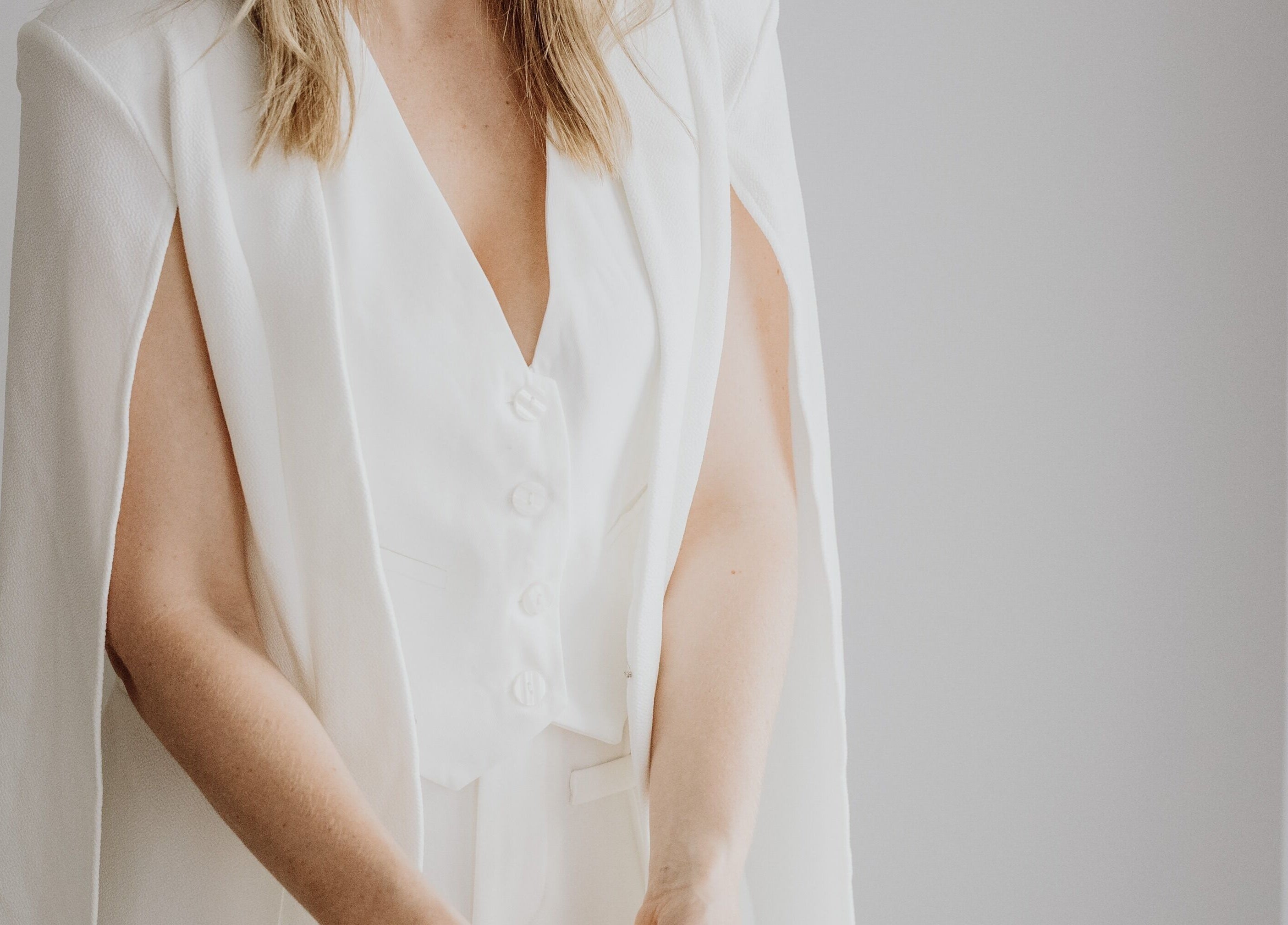 Woman in stylish white blazer at Beauty on Bertha, Logan Reserve, Queensland, AU.
