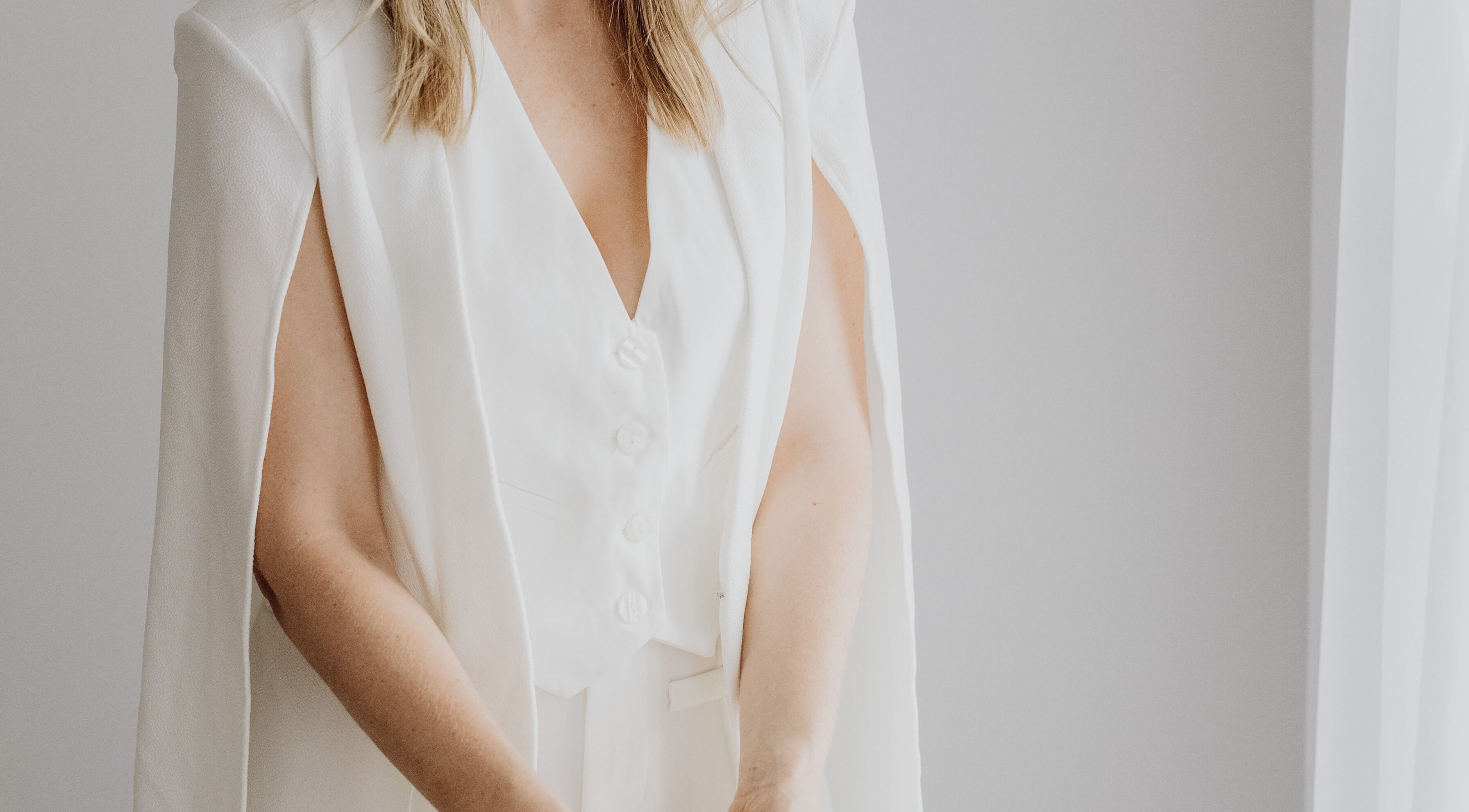 Woman in stylish white blazer at Beauty on Bertha, Logan Reserve, Queensland, AU.
