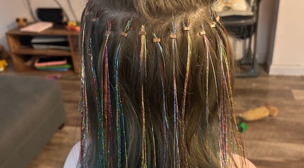 Colorful hair tinsel extensions at Heidi Hair, Edinburgh, Scotland, GB for a dazzling look.