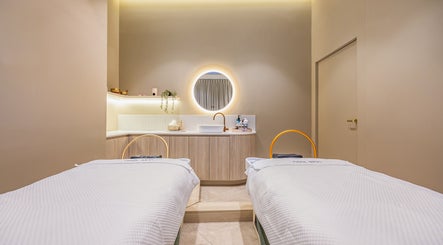 Elegant treatment room at Noa Skin, Zetland, New South Wales, AU, featuring serene decor and plush massage tables.