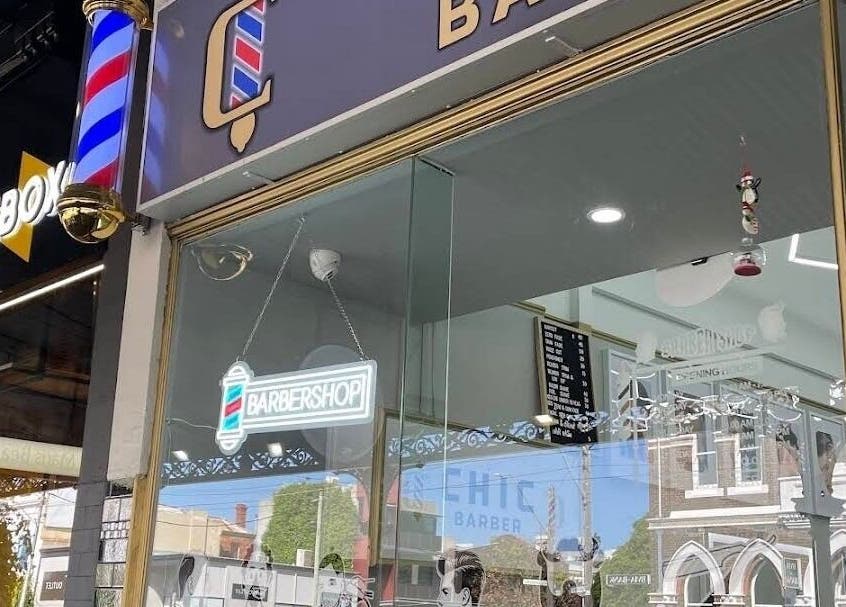 Chic Barber exterior with modern signage in Melbourne, Victoria, AU offering stylish grooming services.