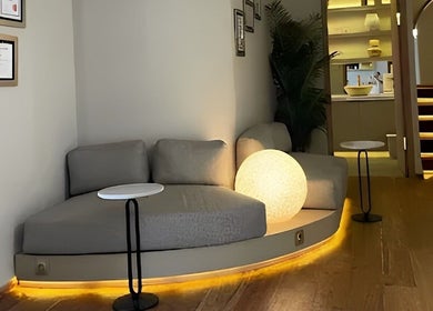 Cozy lounge at NA Clinic, Bali with ambient lighting and modern decor.