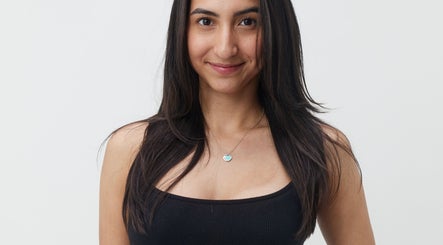 Smiling woman with sleek hair at Mia Lashed, Brampton, Ontario, CA, showcasing natural beauty and confidence.