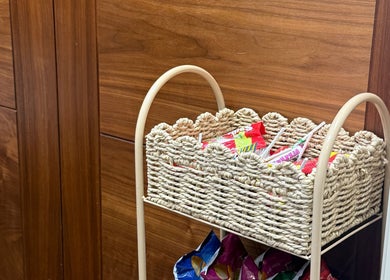 Wicker basket with snacks at Beautybyalmira, St Albans, England, GB enhances guest experience.