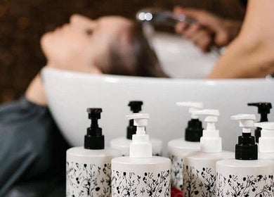 Tranquil salon hair wash at ditch the box, Gqeberha, Eastern Cape, ZA, with lush shampoo bottles in focus.