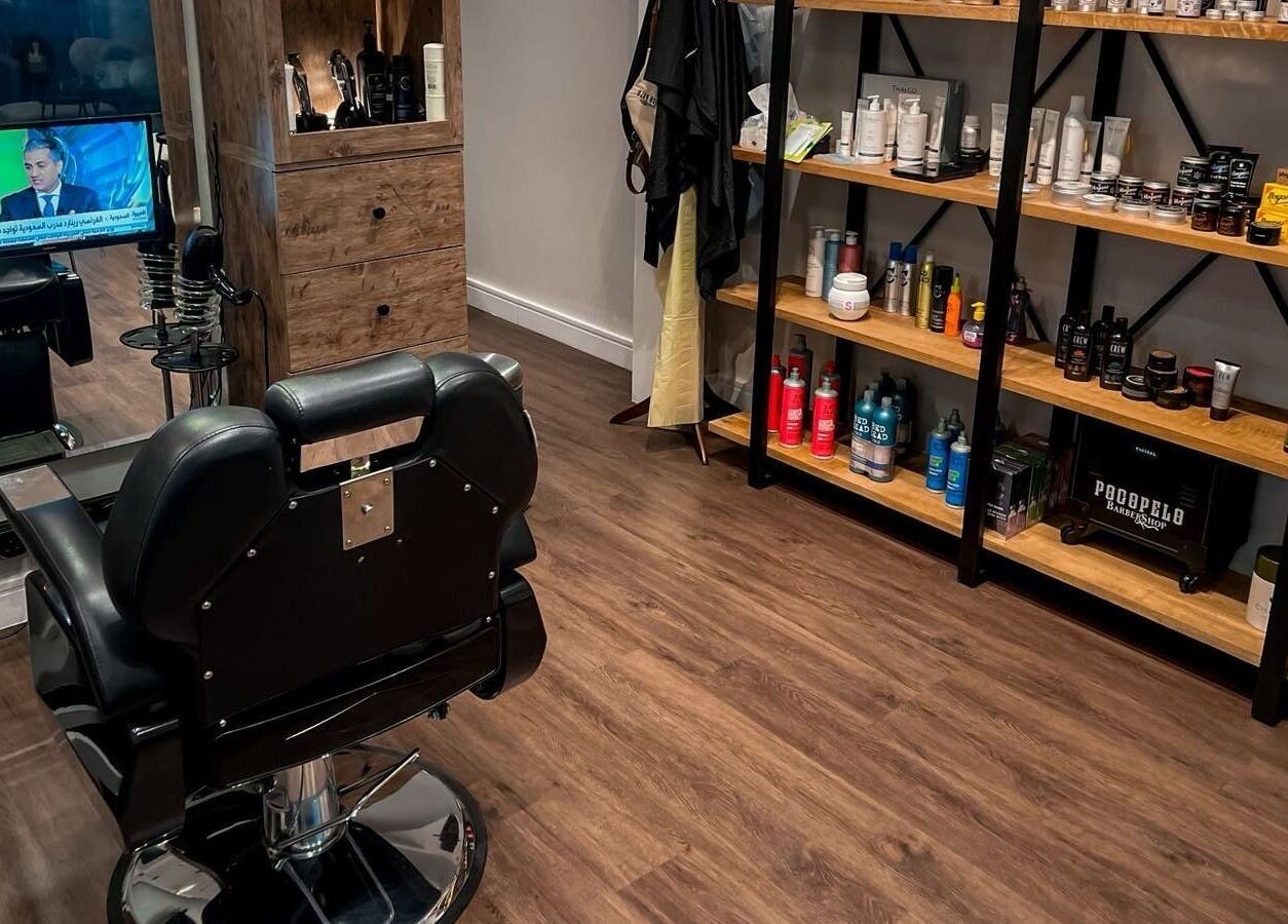 Modern barber chair and product shelves at Poco Pelo Barbershop, Al Khobar, Eastern Province, SA.