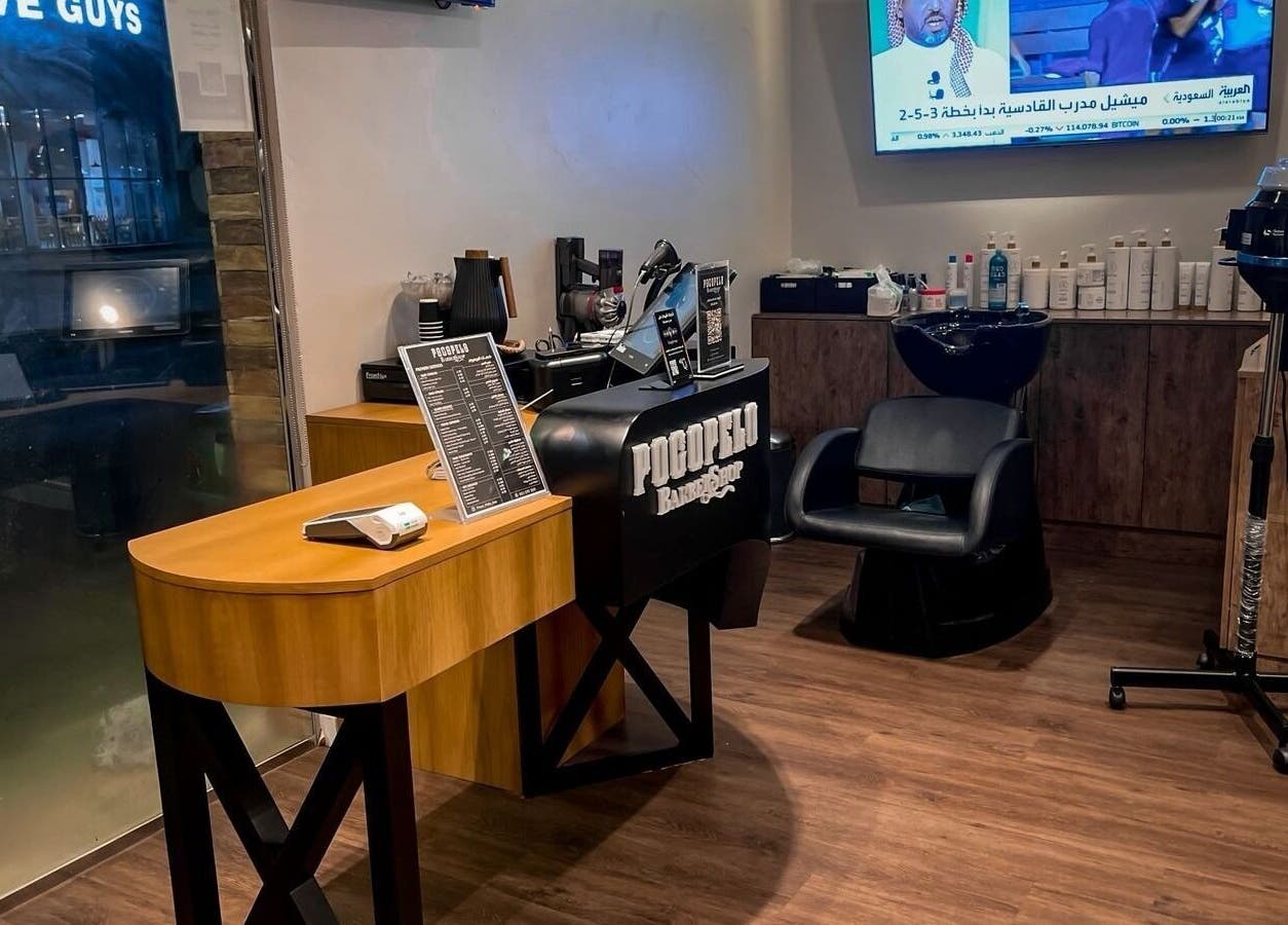 Interior of Poco Pelo Barbershop in Al Khobar, Eastern Province, SA showcasing styling station and modern decor.