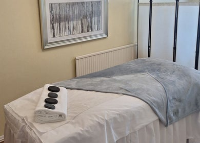 Massage room at Calming-Massage in Blean, England, GB with a cozy table setup.