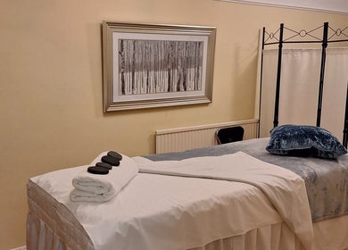 Relaxing massage room at Calming-Massage in Blean, England, GB, featuring a comfortable treatment table.