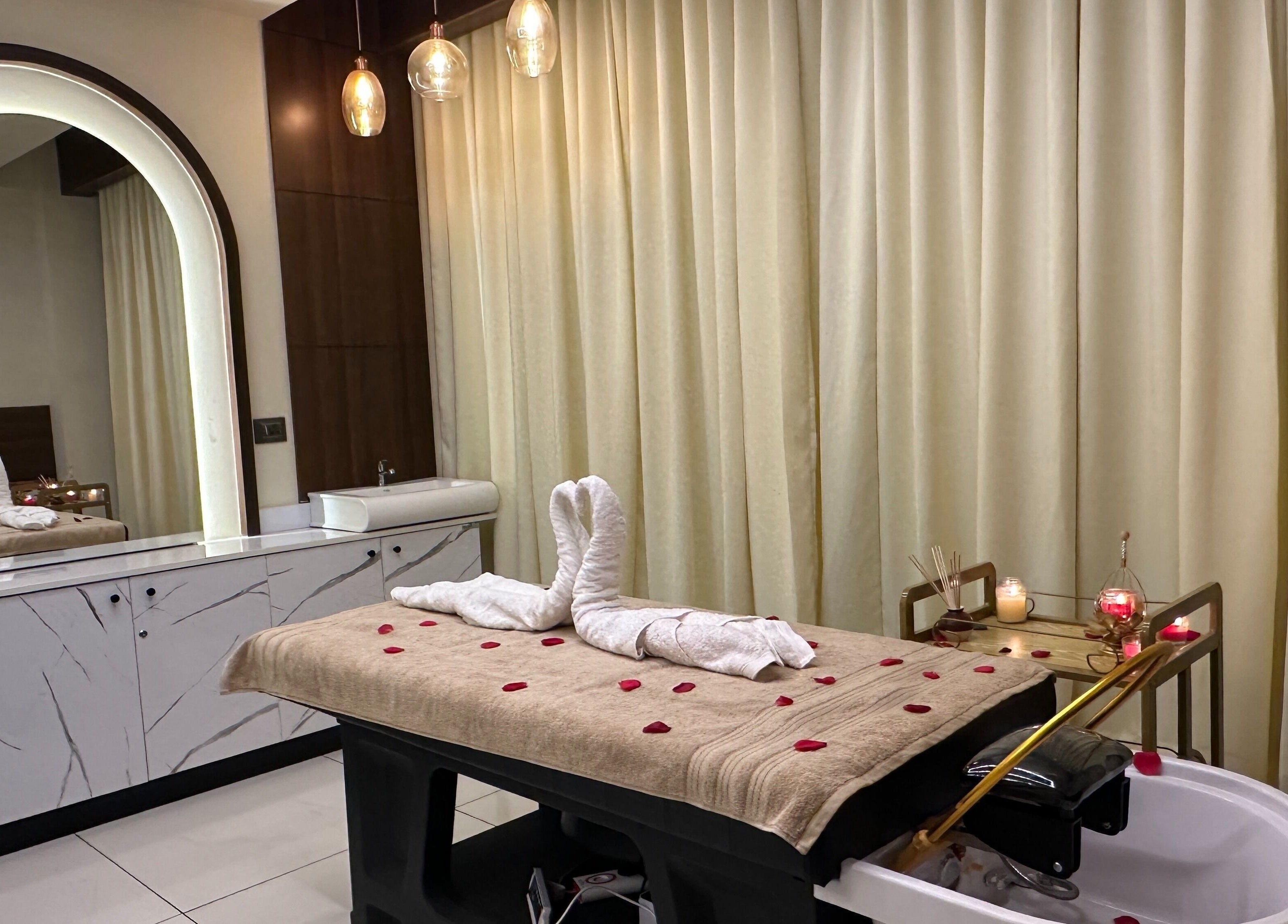 Luxurious spa room at Infinity Pride in Kottarakkara, Kerala, IN with elegant decor and tranquil ambiance.