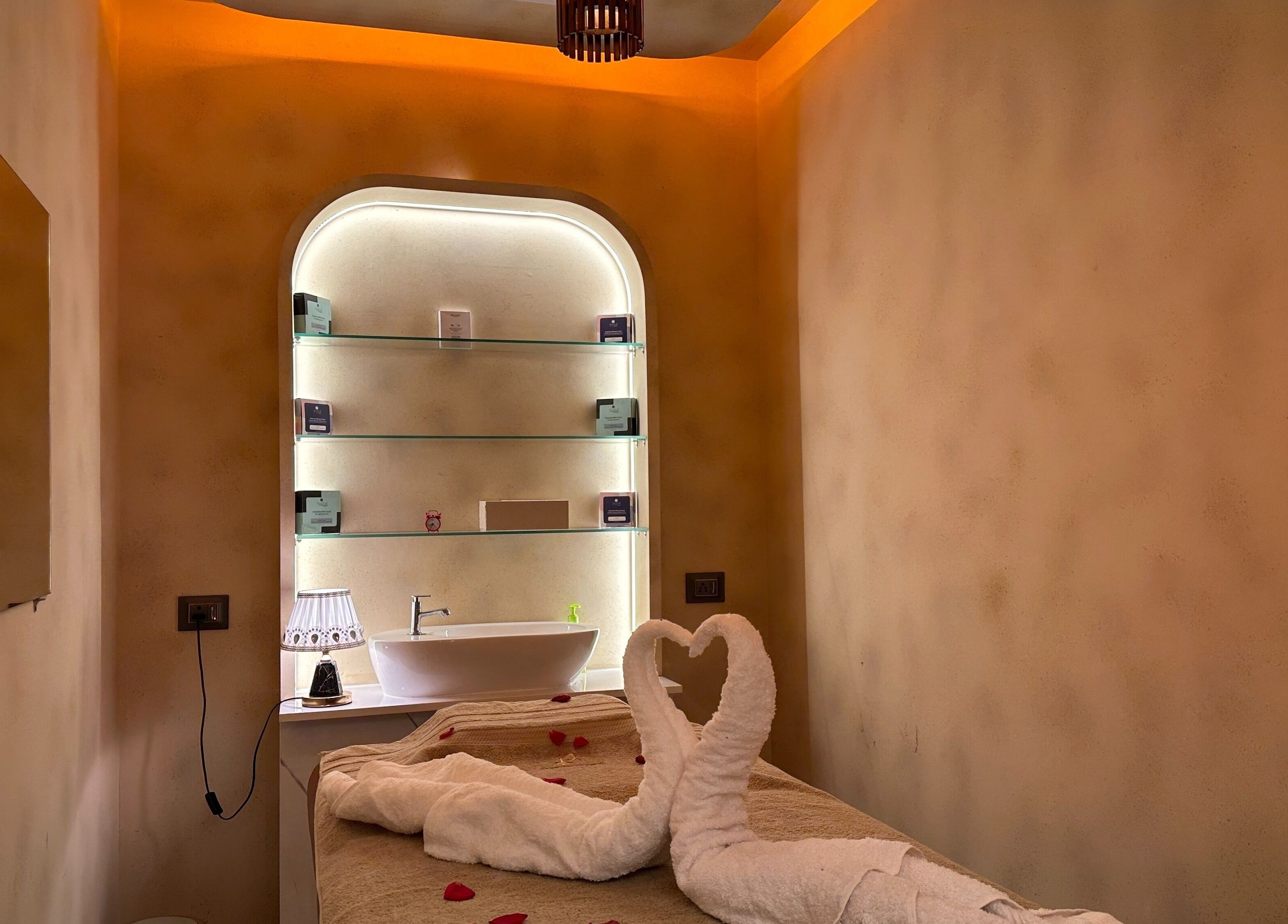 Infinity Pride spa room with towels in heart shape, located in Kottarakkara, Kerala, IN.