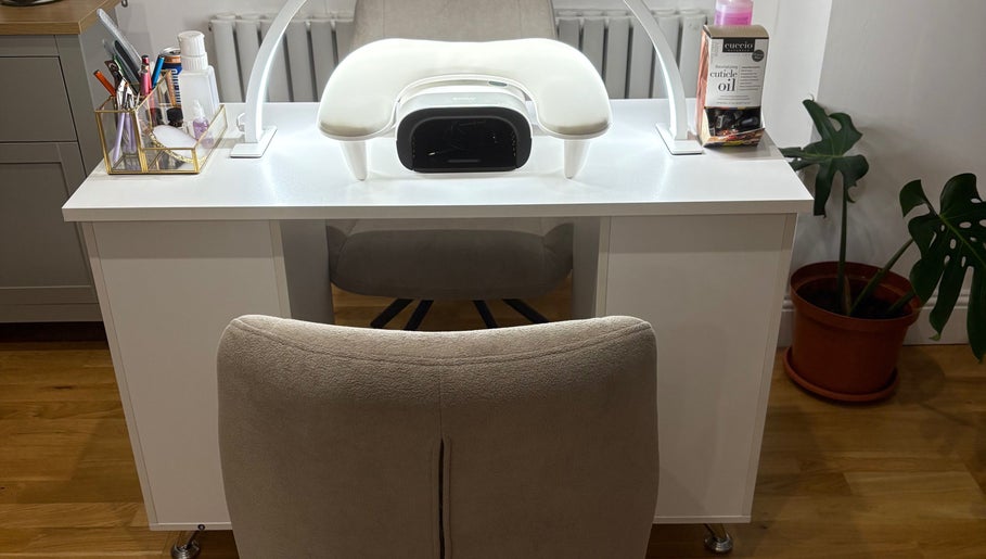 Elegant nail station at Nailin It by Leona in Hamilton, Scotland, GB with manicure tools and cuticle oil.