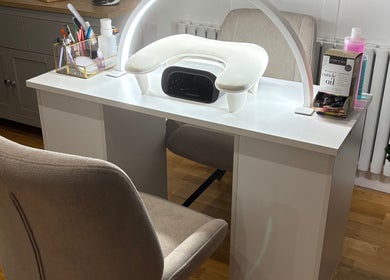 Modern nail station setup at Nailin It by Leona, Hamilton, Scotland, GB, featuring a comfortable chair and tools.