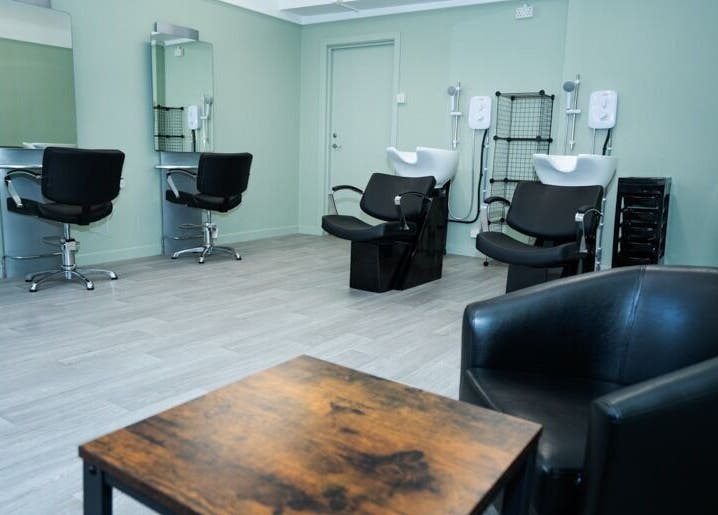 Modern salon interior at Silent Cuts, Downpatrick, Northern Ireland, featuring haircut stations and wash basins.