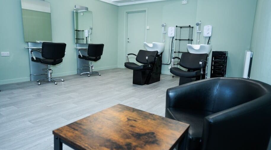 Modern salon interior at Silent Cuts, Downpatrick, Northern Ireland, featuring haircut stations and wash basins.