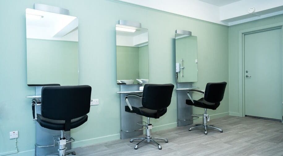 Modern salon chairs and mirrors at Silent Cuts, Downpatrick, Northern Ireland, GB.