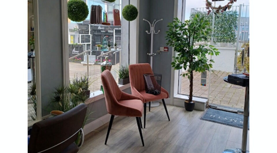 Inviting seating area at Deeva Nails Westport, Westport, County Mayo, IE, with plush chairs and greenery.