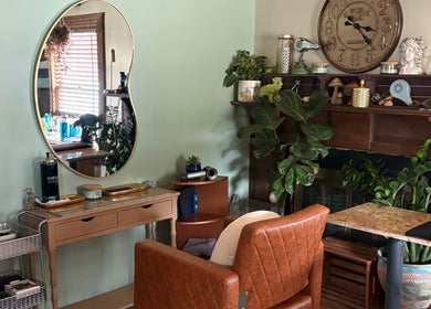 Elegant setting at Oceana Beauty in Nederland, Colorado with chic mirror and cozy decor.