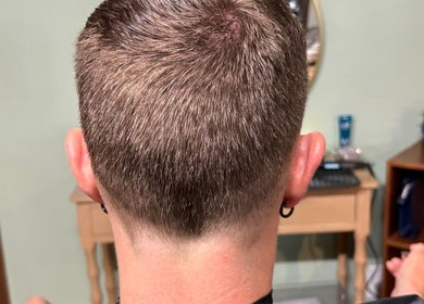 Back view of a fresh haircut at Oceana Beauty in Nederland, Colorado, US, showcasing precision styling.