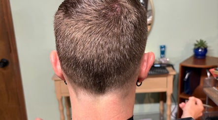Back view of a fresh haircut at Oceana Beauty in Nederland, Colorado, US, showcasing precision styling.