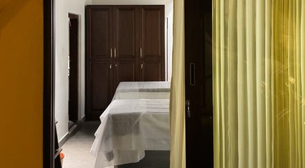 Tranquil massage room with crisp linens at Gramam Living - Spa, Varkala, Kerala, IN