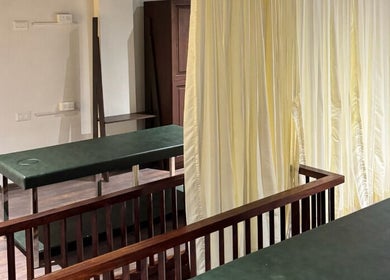 Tranquil massage room with green tables at Gramam Living - Spa, Varkala, Kerala, IN.