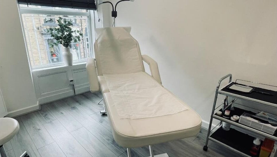 Elegant treatment room at The Definery, Bradford, England, GB featuring a comfortable chair and tools.