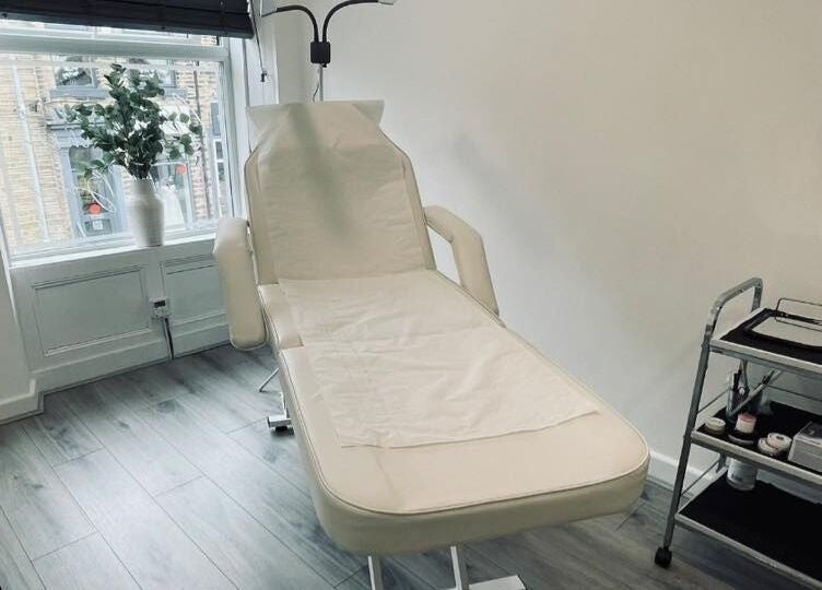 Elegant treatment room at The Definery, Bradford, England, GB featuring a comfortable chair and tools.