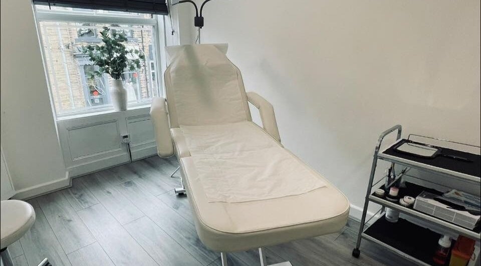 Elegant treatment room at The Definery, Bradford, England, GB featuring a comfortable chair and tools.