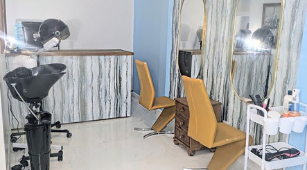 Stylish salon interior at Blueberry Locs Uk, Longfield, England, GB, showcasing modern hairdressing chairs and mirrors.
