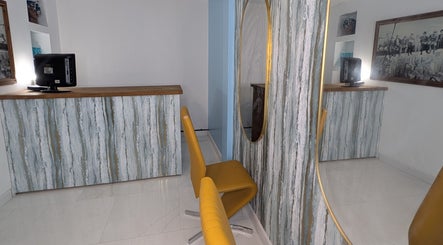 Elegant salon desk and mirror at Blueberry Locs Uk in Longfield, England, enhancing a serene atmosphere.