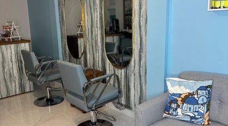 Stylish salon interior at Blueberry Locs Uk, Longfield, England, GB with modern chairs and artistic decor.