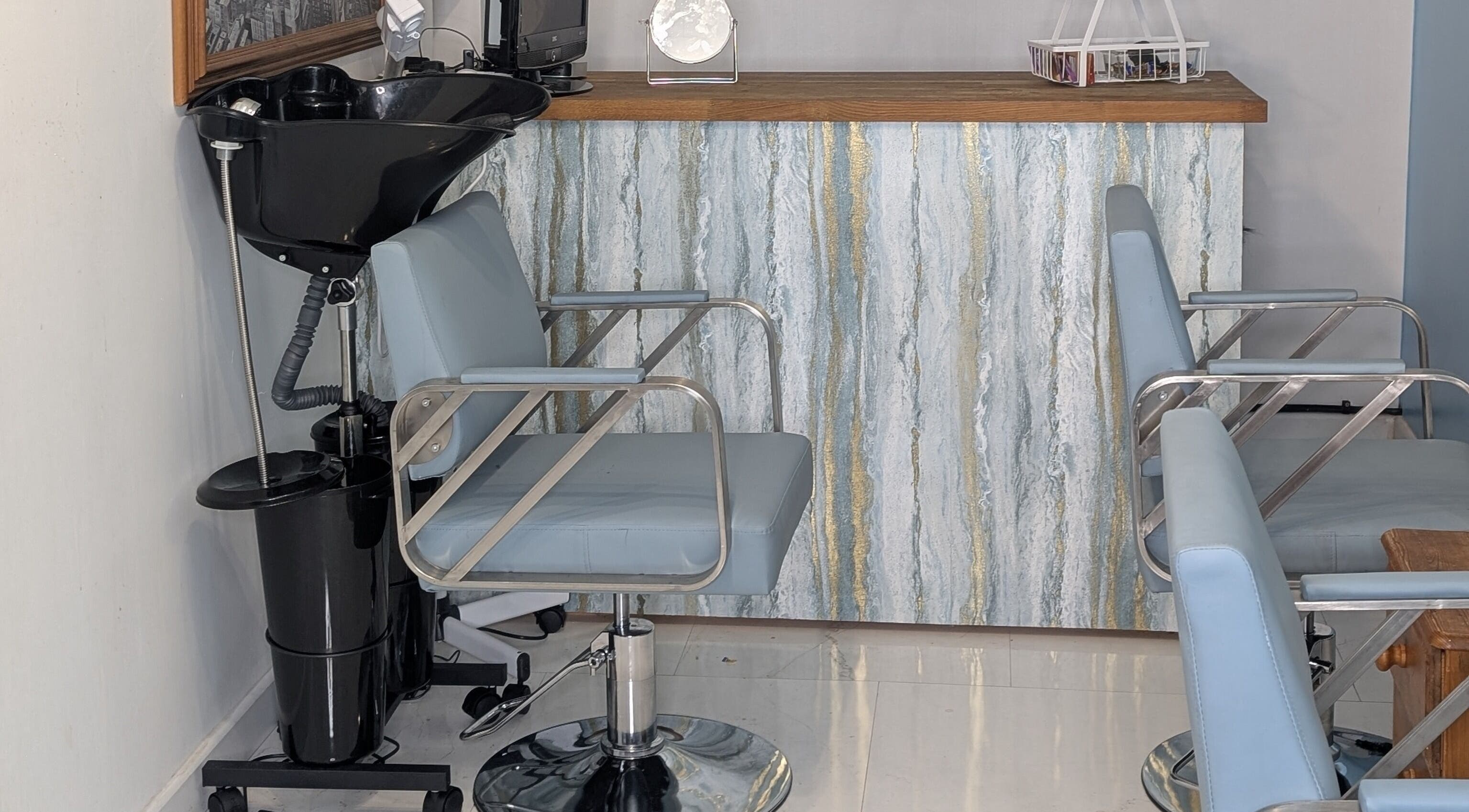 Stylish salon chairs at Blueberry Locs Uk in Longfield, England, GB enhance client comfort.