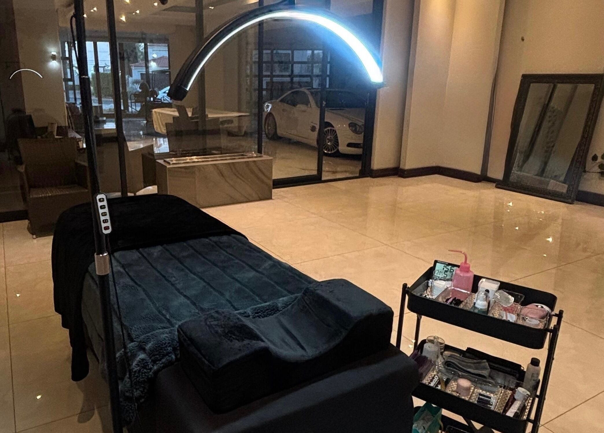 Luxurious treatment room at Aura Lash Studio, Midrand, Gauteng, ZA. Features spa bed and tool trolley.