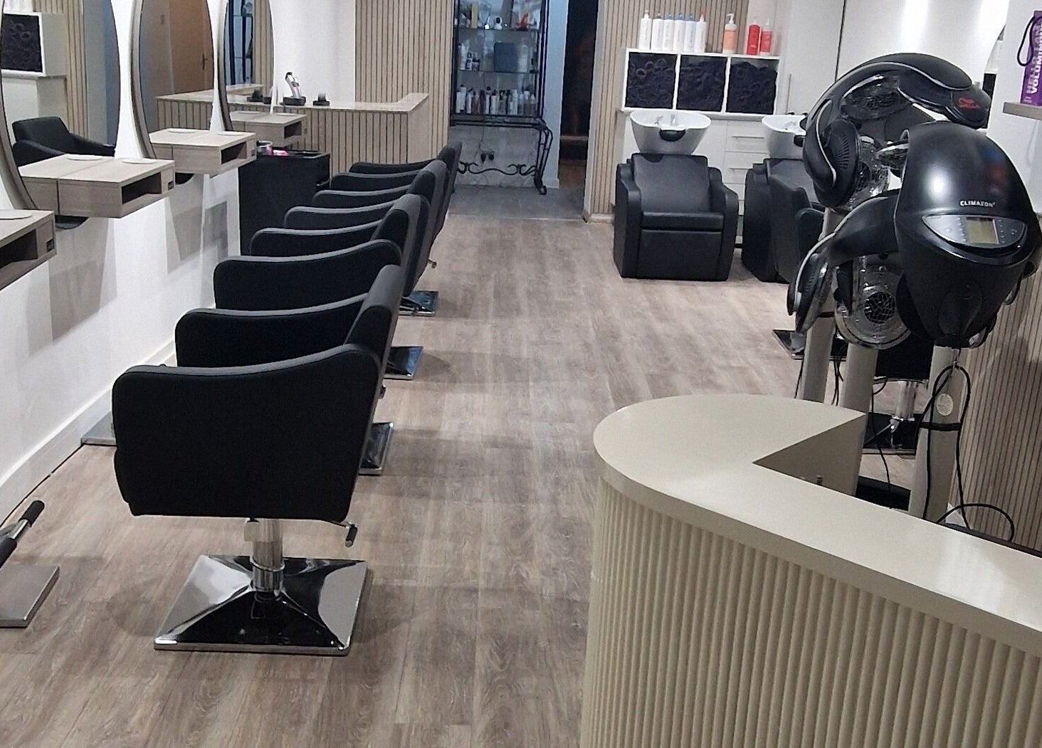 Modern salon interior at Dimensions Different, Gosport, England, GB with stylish seating and equipment.