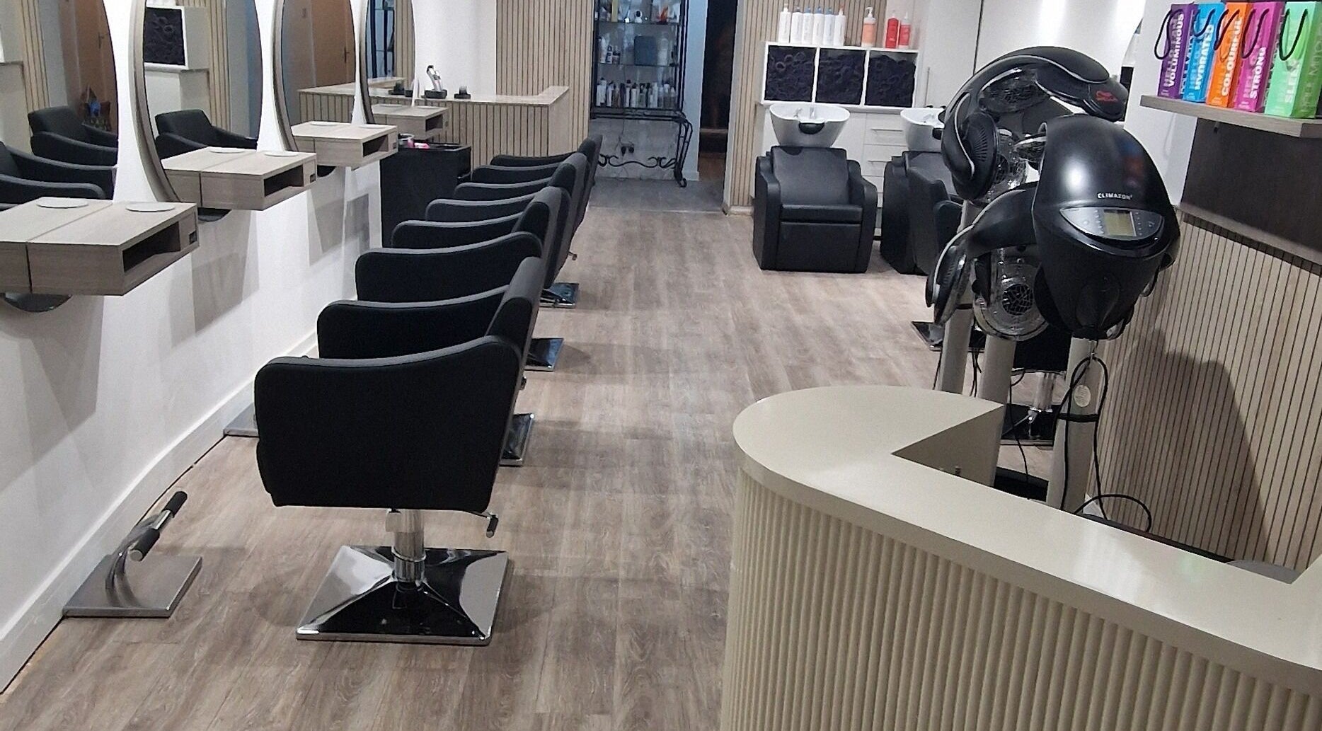 Modern salon interior at Dimensions Different, Gosport, England, GB with stylish seating and equipment.