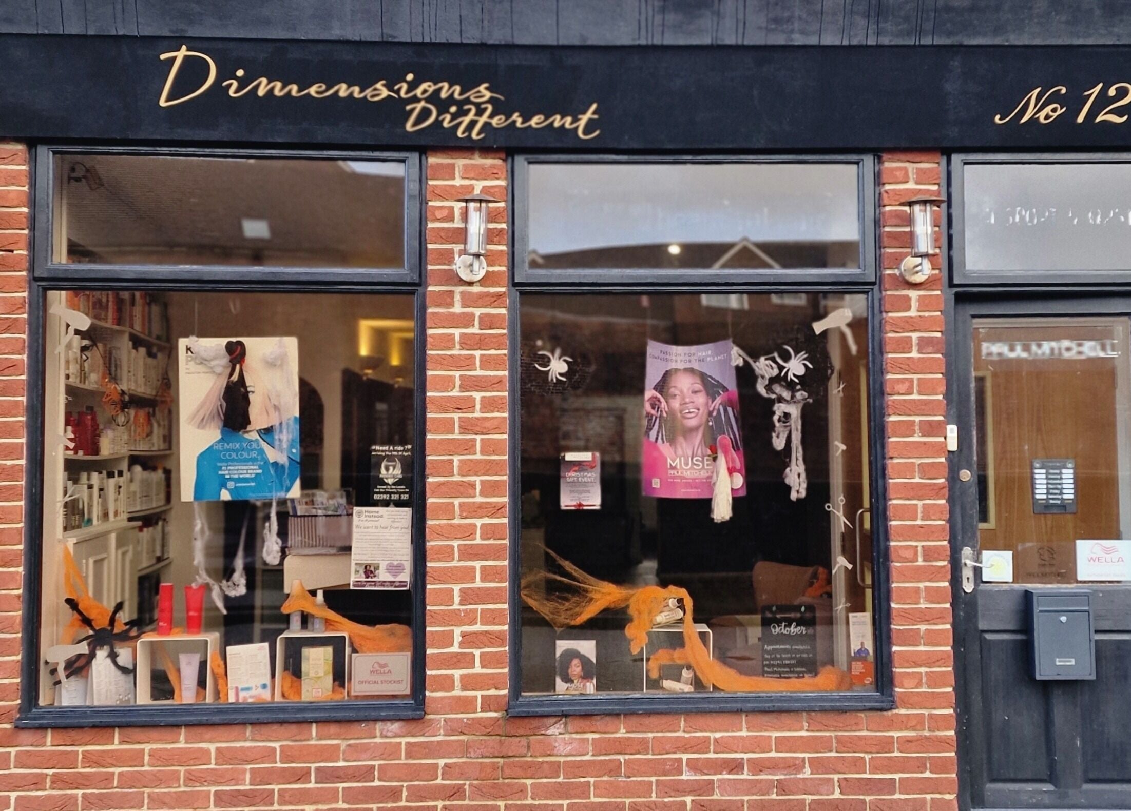 Dimensions Different facade in Gosport, England, GB with inviting brick exterior and vibrant window display.