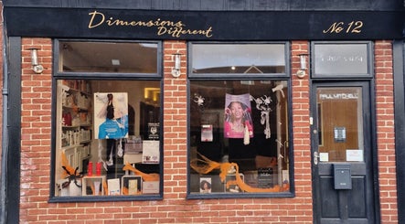 Dimensions Different salon facade featuring stylish window display in Gosport, England, GB.