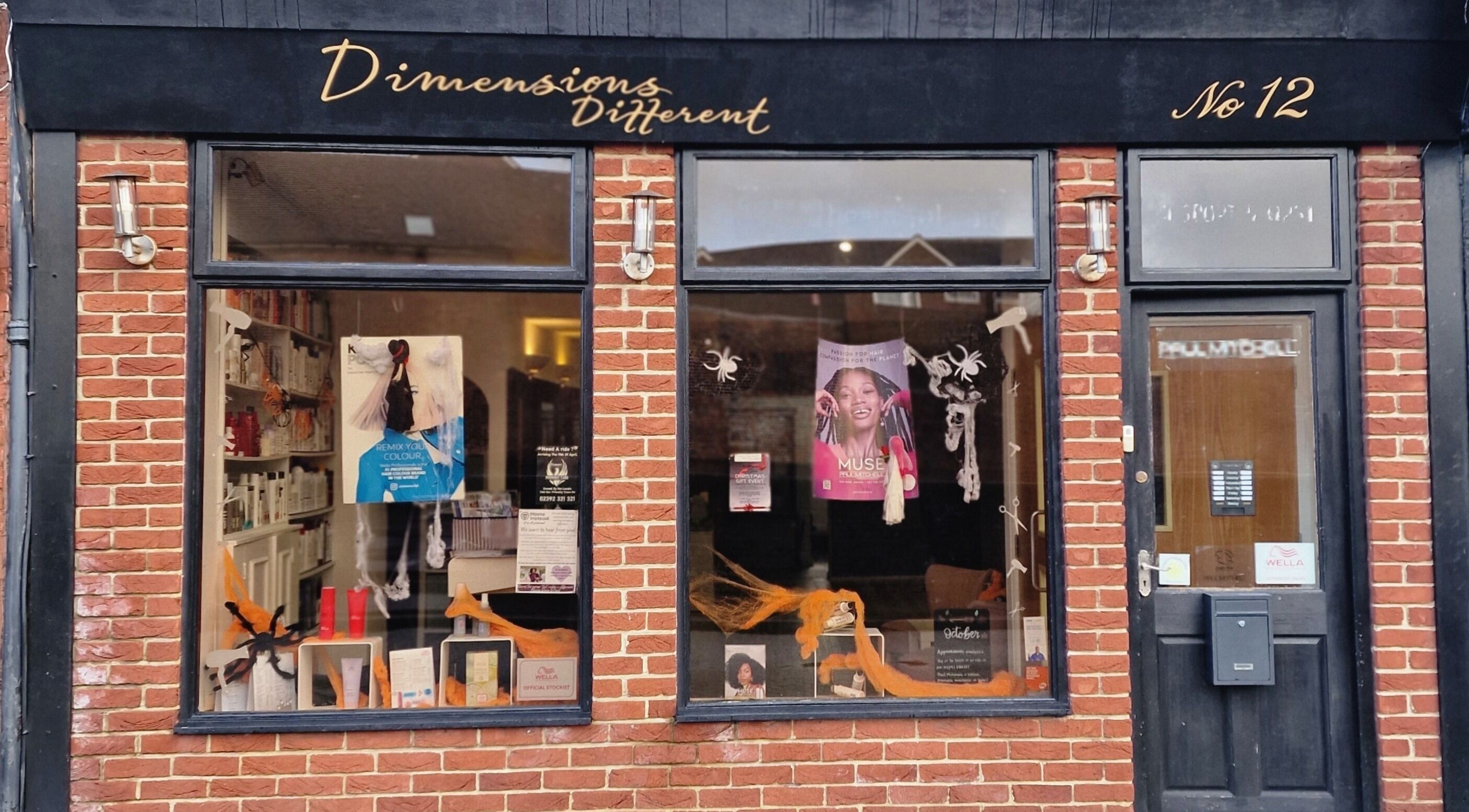Dimensions Different facade in Gosport, England, GB with inviting brick exterior and vibrant window display.
