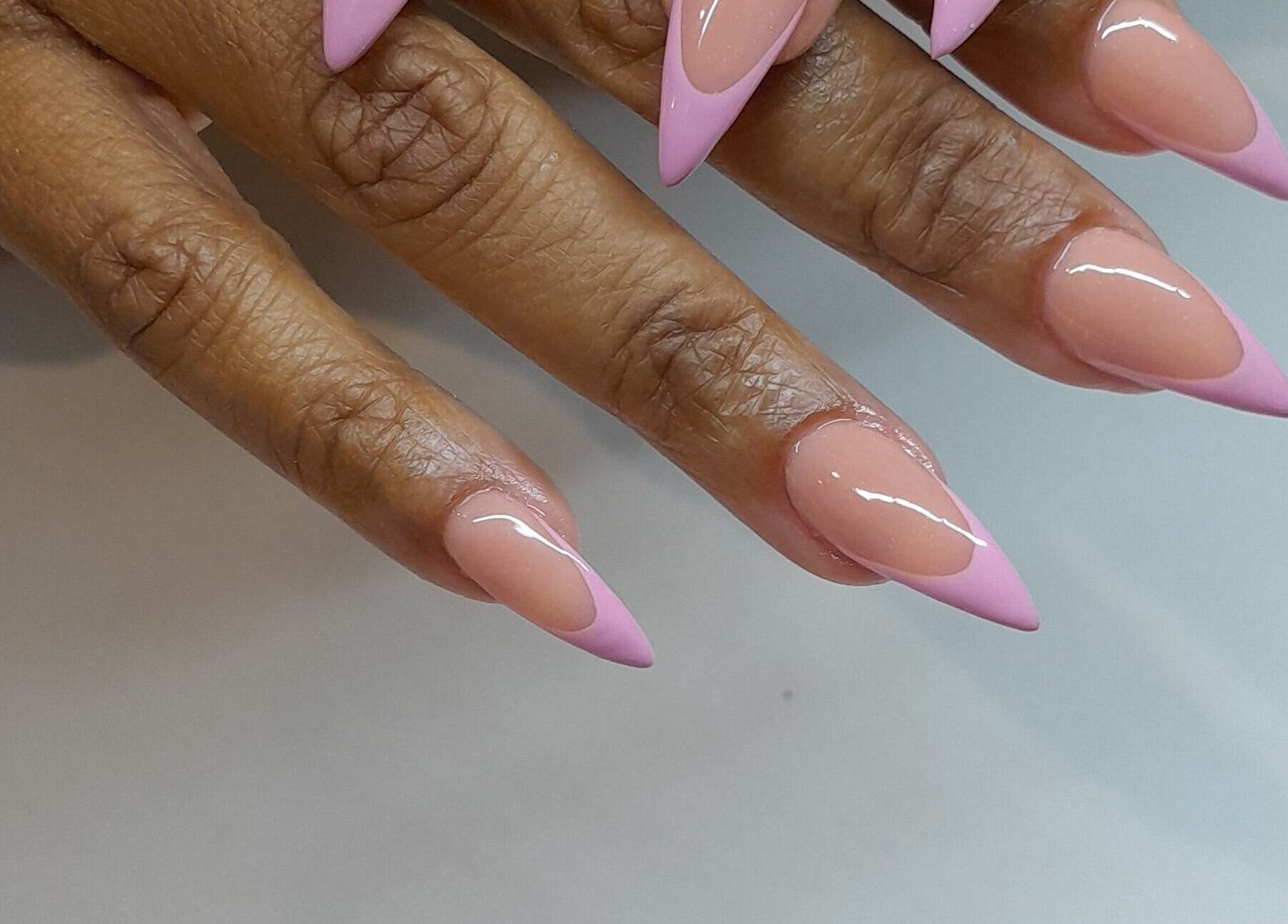 Stylish glossy pink-tipped nails at Emmy's nails, Cape Town, Western Cape, ZA.