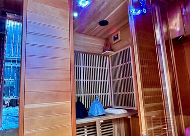Cozy sauna at Plas Courtyard Spa, Llanbedr, Wales, GB offering a serene relaxation experience.