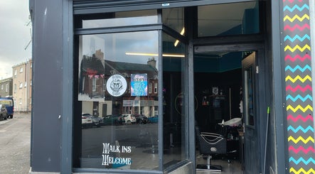 Entrance of Kult Hair salon in Ayr, Scotland, GB featuring modern interior and welcoming signage.