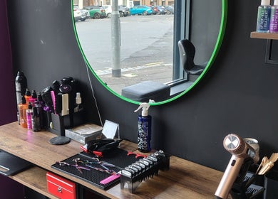 Chic styling station at Kult Hair, Ayr, Scotland, GB with haircare tools and products neatly arranged.
