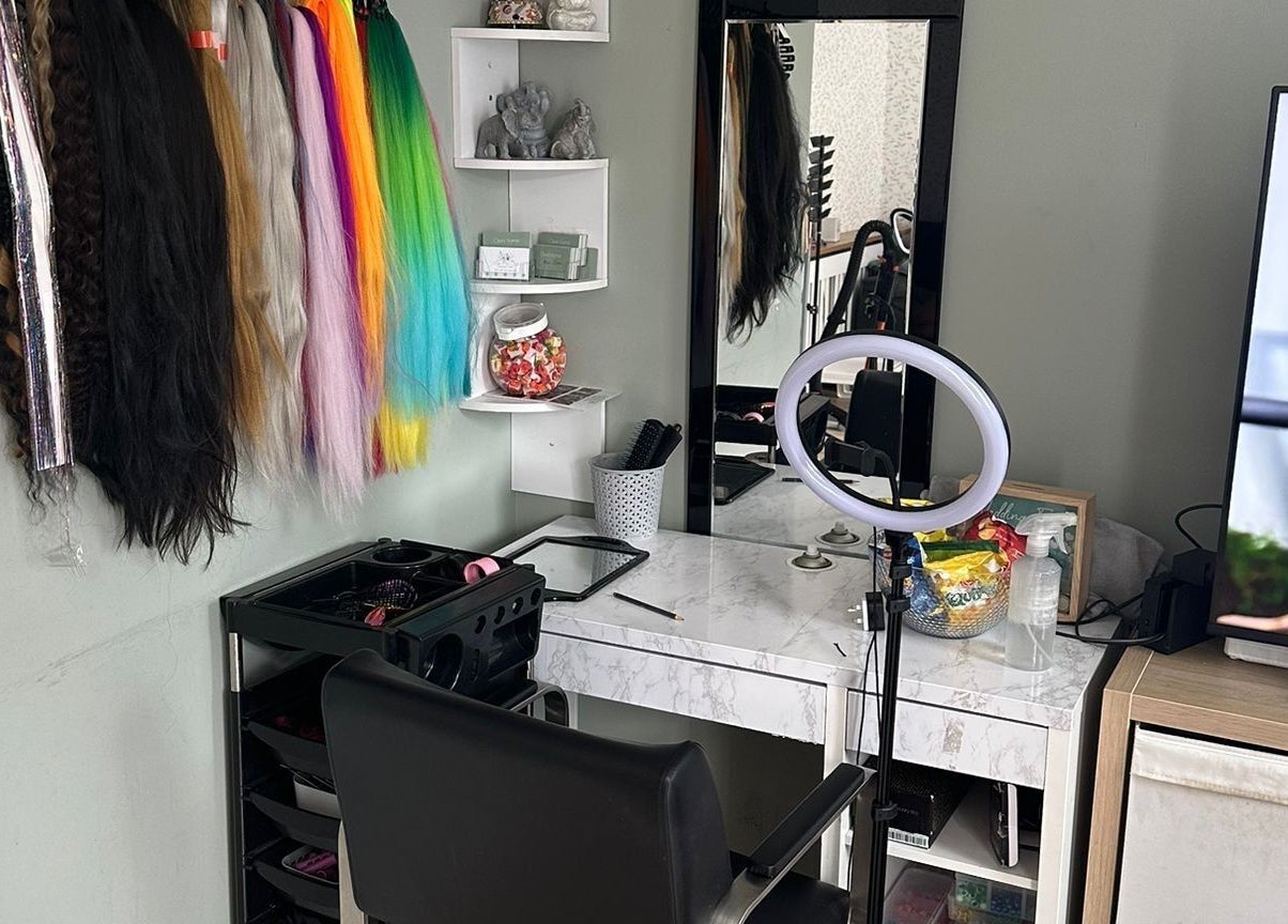 Colorful hair extensions displayed at Hair Me Out, Dagenham, England, GB beauty station with professional setup.