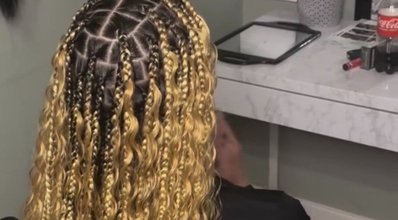 Intricate braided hairstyle at Hair Me Out, Dagenham, England, GB showcasing skilled craftsmanship.