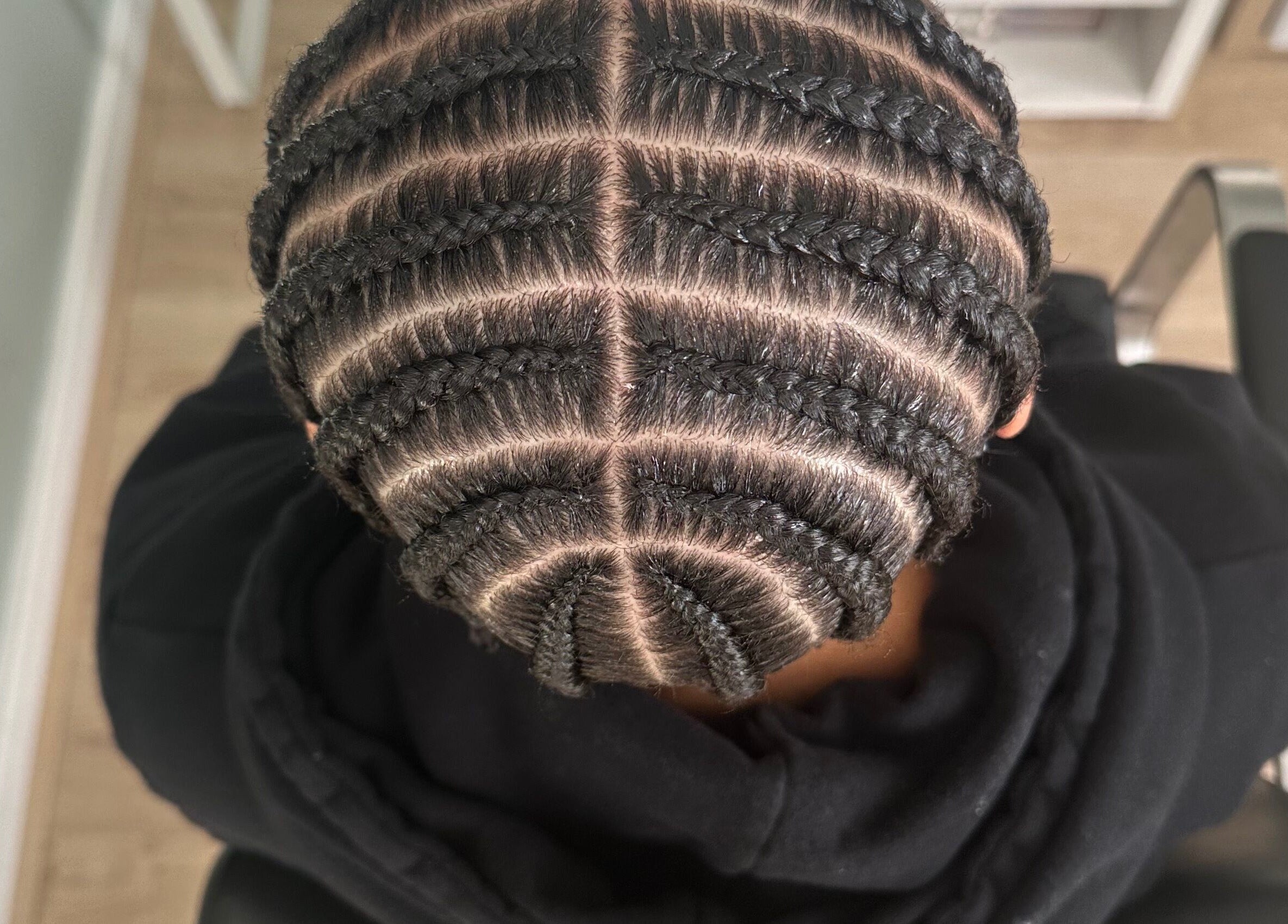 Detailed braid design at Hair Me Out in Dagenham, England, GB, showcasing elegant hair artistry.